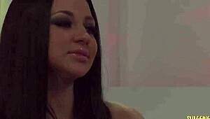 Model With Big Boobs Poses On The White Sofa