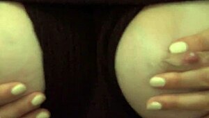 breastmilk fountain flows as young lady in glasses lets down during solo play.