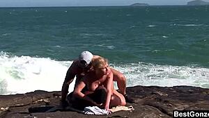 busty blonde tarra white in ocean threesome sucking big cock
