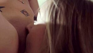 blonde girl casually licking her busty brunette friend's pussy