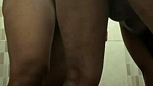 Mertua idaman shares intimate moment with menantu in private bathroom setting.