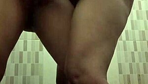 Mertua idaman shares intimate moment with menantu in private bathroom setting.