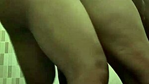 Mertua idaman shares intimate moment with menantu in private bathroom setting.