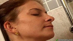 Lesbian mature milf licks big tits in steamy shower with raw mommy action