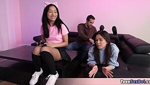 Two gamer chicks keep playing while horny stepbro fucks them in wild FFM action