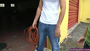 Two amateur guys engage in intimate activities outdoors in a public setting