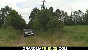 Two Buddies Fuck Sexy Blonde Grandma Outdoors in Wild Group Action