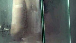 brunette dries off nude in messy bathroom