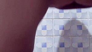 Mature woman flashing pussy in hotel bathroom!