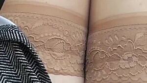 In the car, she removes her panties and pleasures herself on the street, inviting voyeurs to watch her intimate display