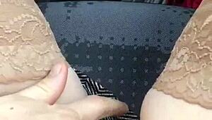 In the car, she removes her panties and pleasures herself on the street, inviting voyeurs to watch her intimate display