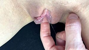 Teen close-up shows squirting orgasm from fingering her dripping wet shaved pussy