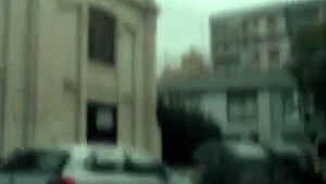 In the car, she removes her panties and pleasures herself on the street, inviting voyeurs to watch her intimate display