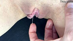Teen close-up shows squirting orgasm from fingering her dripping wet shaved pussy