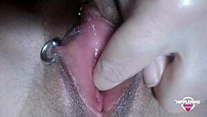 This kinky mother Nippleringlover fingers and fists her pierced pussy. She pinches those extreme pierced nipples in a wild compilation!