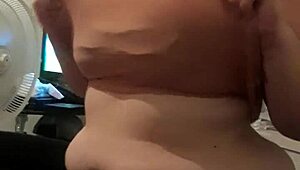 Redhead MILF giving blowjob to voyeur with music