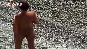 hot babe struts naked on beach with buttplug