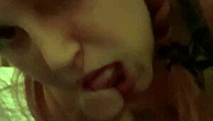 Redhead MILF giving blowjob to voyeur with music