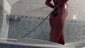 Sexy babe Camilla Moon caught masturbating her tight pussy in bathroom on cam
