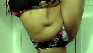 Big tit ebony milf dances in the bathroom