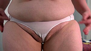 curvy milf pisses in white panties showing off dirty fetish.
