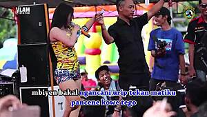 indonesian singers perform wild erotic dance on stage with eager crowd