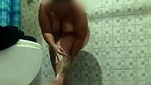 Hidden Cam in Shower Spies on Mature Stepmom's Assets