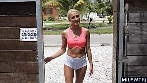 The blonde athletic cougar wife cheats with a younger man in the gym.