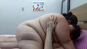 romantic couple having hot sex in bed with big tits and blowjob action.