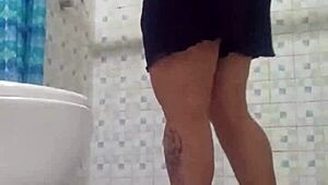 Hidden Cam in Shower Spies on Mature Stepmom's Assets