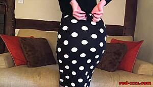 a mature redhead engages in dirty talk and fingering