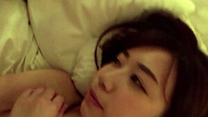 Young Asian beauty gets naughty in hotel room