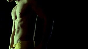 hot young gay guy performs acrobatic strip tease, ripping clothes while dancing on the pole