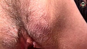 Close up of a hairy pussy of a European housewife during orgasm