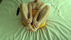 Lana in yellow dress fingers her pussy alone at home.