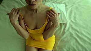 Lana in yellow dress fingers her pussy alone at home.