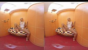 Blonde Karol Lilien masturbates bent over in shower