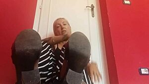 hey, stepson, your blonde stepmom’s feet are killing her. wanna help out with a quick rub?