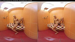 Blonde Karol Lilien masturbates bent over in shower