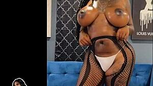 Black MILF oiled up in high heels and fishnets