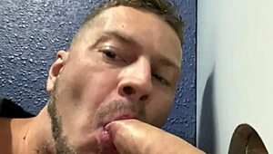 Close-up shots of amateur gay men giving blow jobs to big and fat dicks through a glory hole