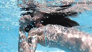 Hot chick lana swims nude underwater in the pool for your pleasure.