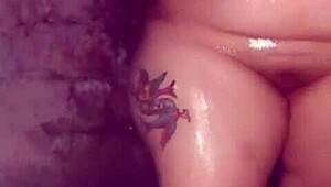 A bisexual mature woman has a bath and masturbates