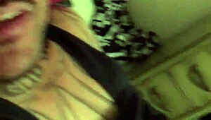 A mature white trash woman gives a blowjob to a small black cock