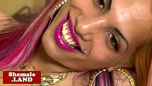 alternative shemale beauty wanks off solo in lingerie close-up.