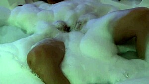 Beautiful Stepmother in Motel Jacuzzi Flashes Natural Tits Before Masturbating with Toys