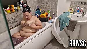 Pervert spies on BBW milf washing giant floppy tits in bath