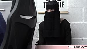 Cute Muslim chick caught hiding stolen goods under her outfit