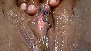 ebony self pleases her ass with toys