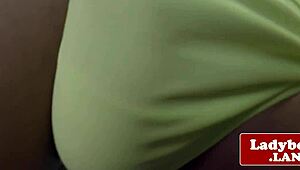 Busty ladyboy solo rubs her hard cock close-up.